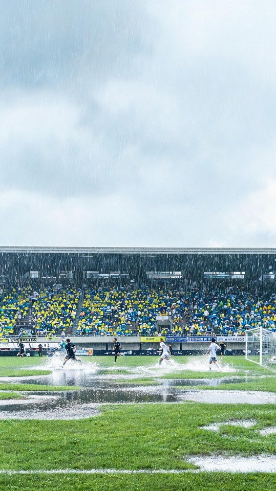 Osan-si Soccer Game in Rain - 4K Phone Background