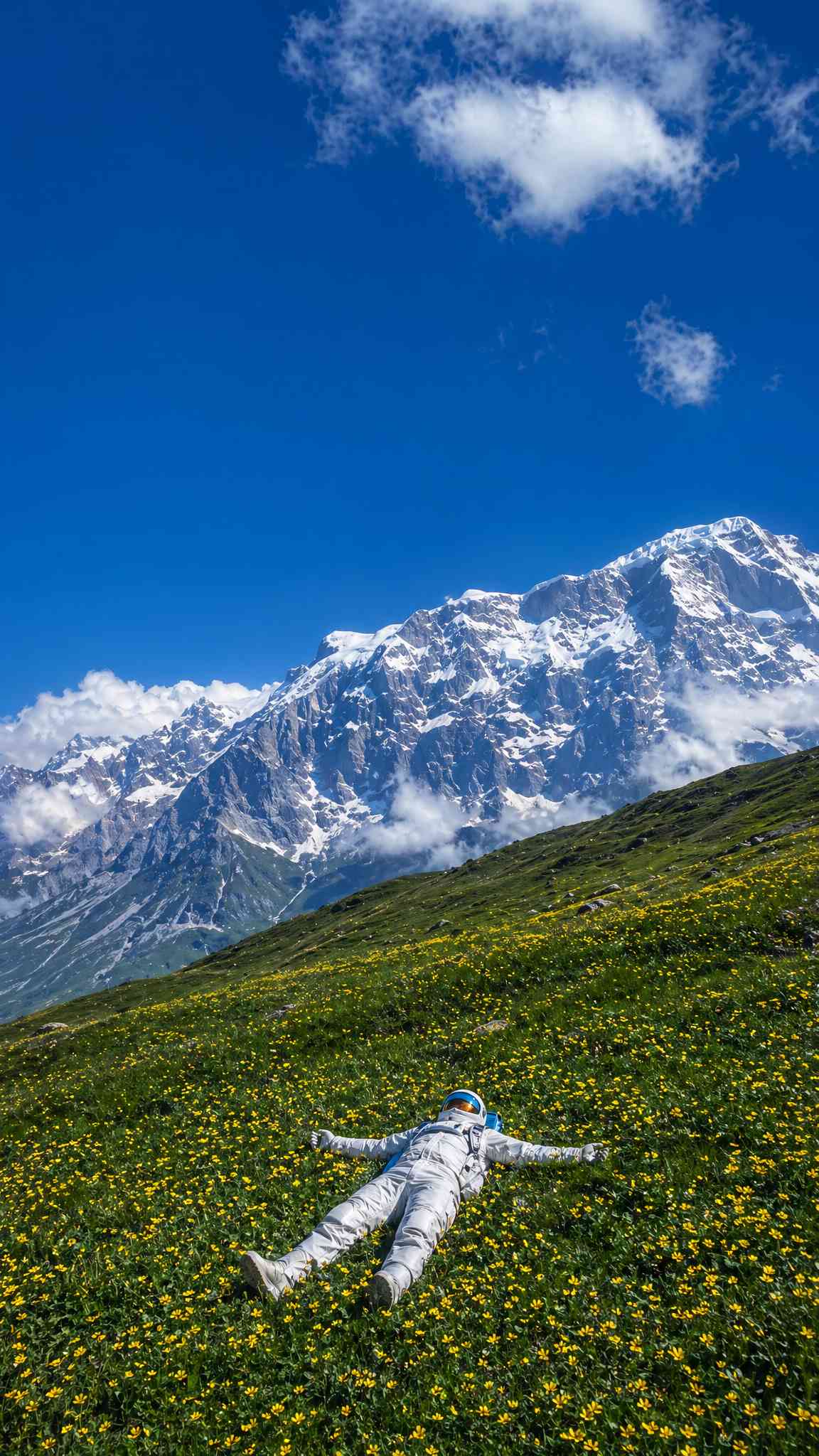 Astronaut's Alpine Dream: 4K Mountain & Flower Field Wallpaper