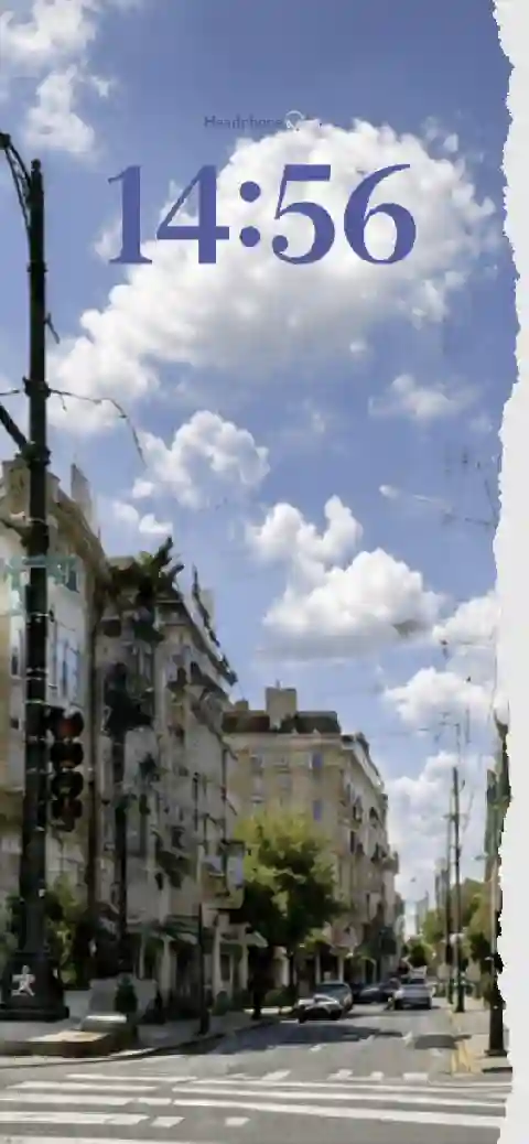 Aesthetic street view with blue sky and torn paper edge customizable live wallpaper template.